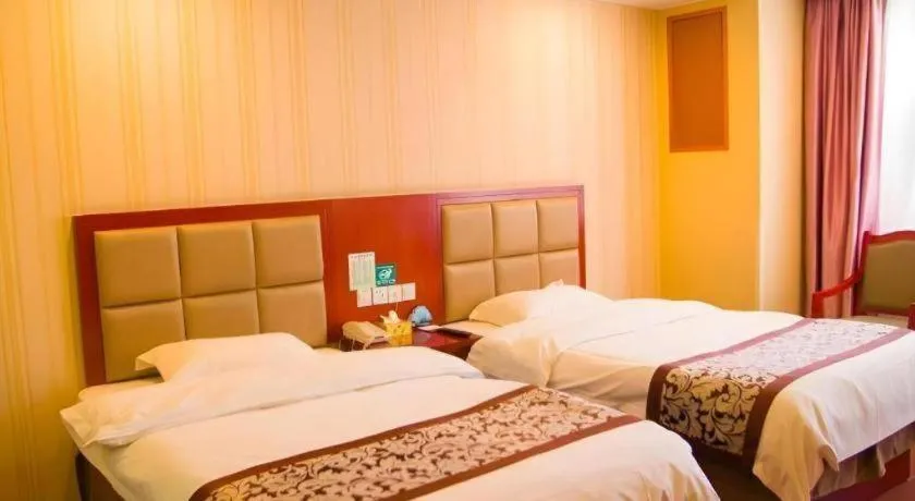 Bed in GreenTree Inn Chuzhou City Quanjiao County High-Speed Italy Trade City Business Hotel