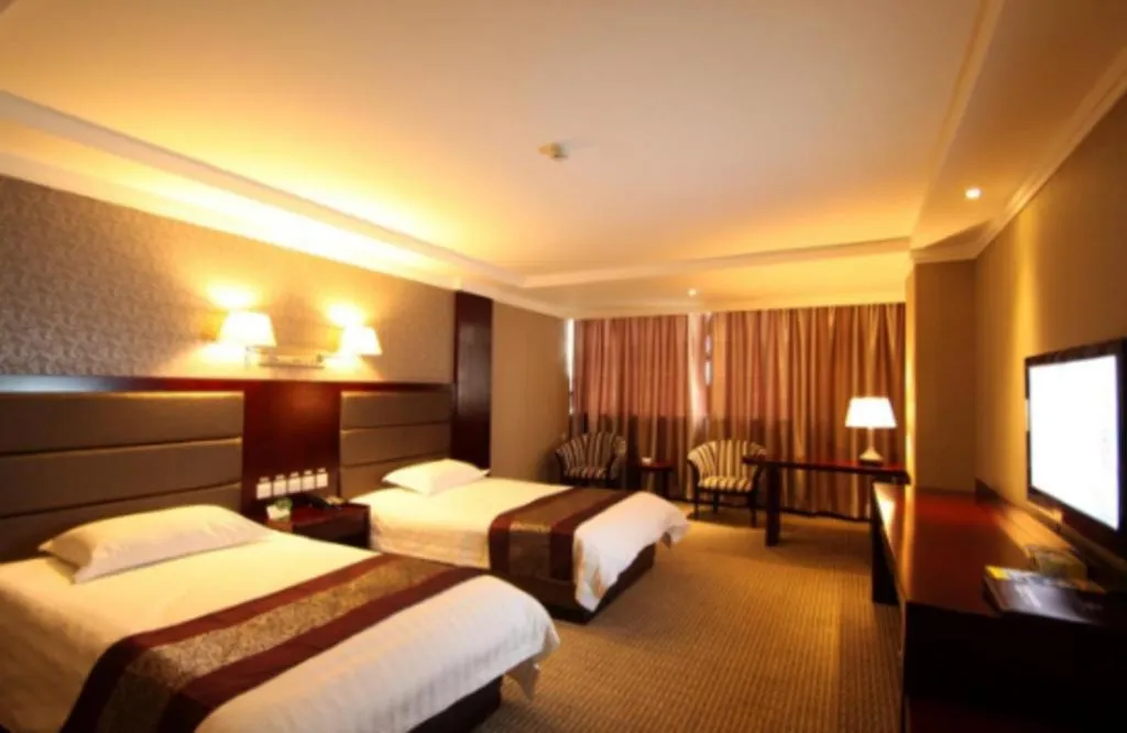 Bed in GreenTree Inn Chuzhou City Quanjiao County High-Speed Italy Trade City Business Hotel