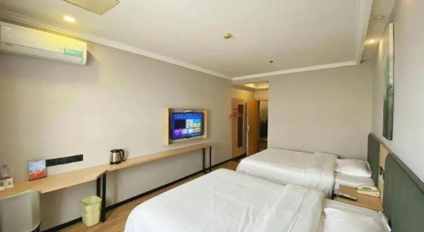 Bed in GreenTree Inn Taizhou New District Hospital of Renmin Hospital Mingliu Express Hotel
