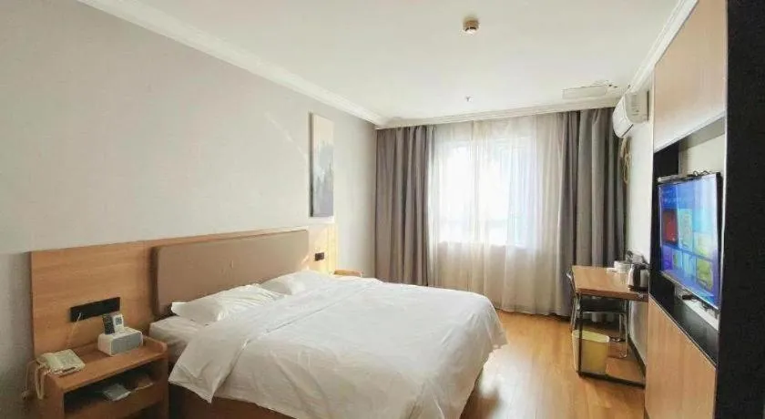 Bed in GreenTree Inn Taizhou New District Hospital of Renmin Hospital Mingliu Express Hotel