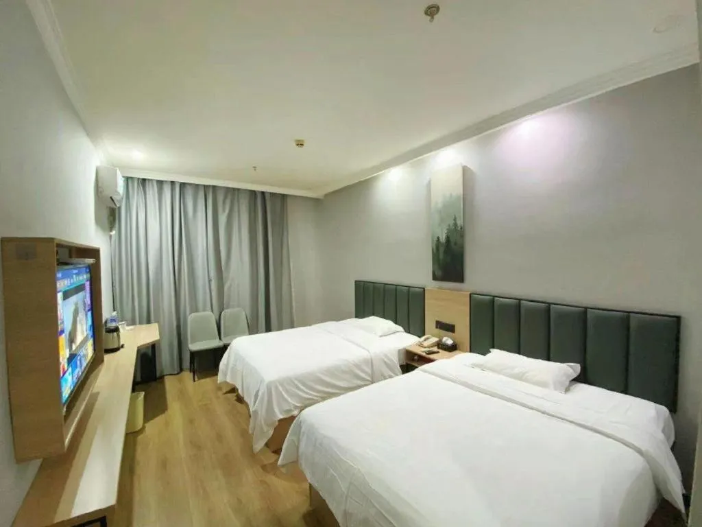 Bed in GreenTree Inn Taizhou New District Hospital of Renmin Hospital Mingliu Express Hotel