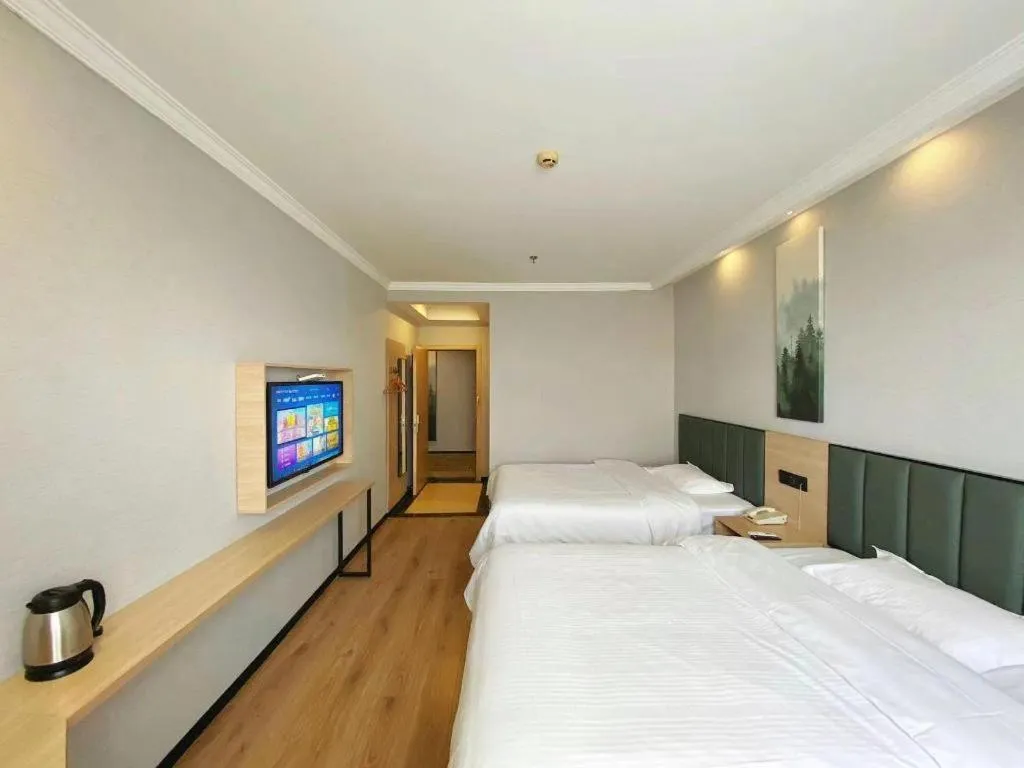 Bed in GreenTree Inn Taizhou New District Hospital of Renmin Hospital Mingliu Express Hotel