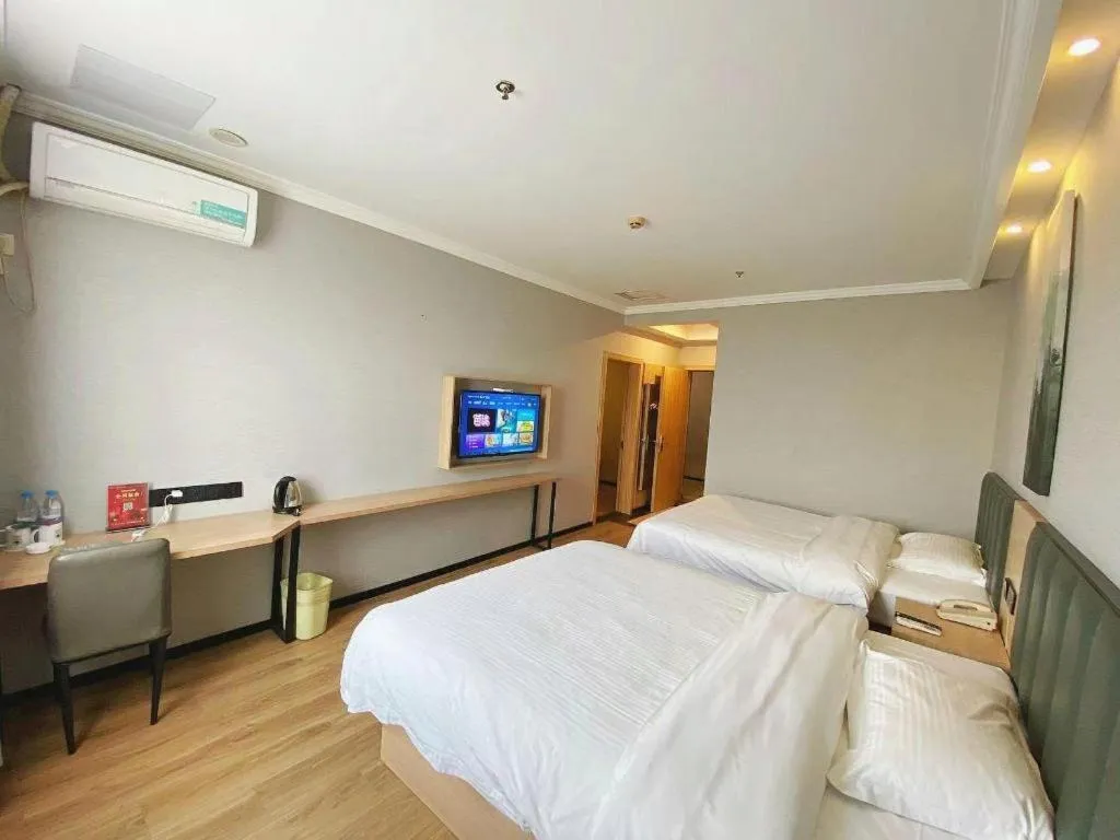 Bed in GreenTree Inn Taizhou New District Hospital of Renmin Hospital Mingliu Express Hotel