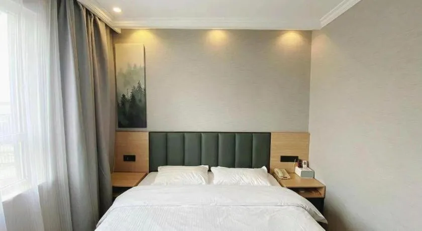 Bed in GreenTree Inn Taizhou New District Hospital of Renmin Hospital Mingliu Express Hotel