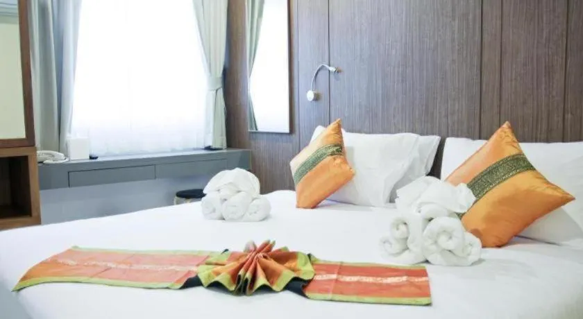 Bed in Elegancy Sansabai Hotel