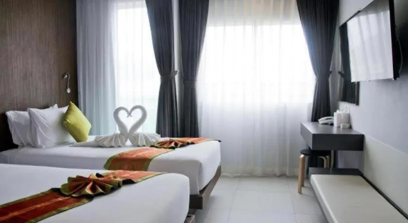 Bed in Elegancy Sansabai Hotel