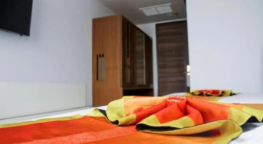 Bed in Elegancy Sansabai Hotel