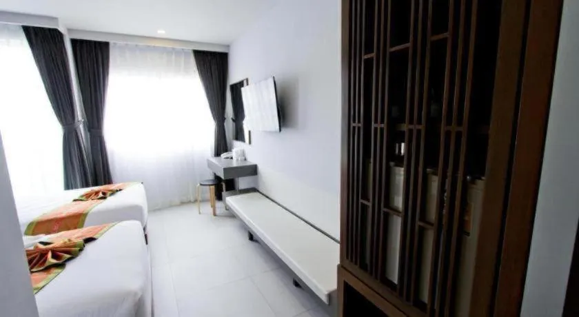 Bed in Elegancy Sansabai Hotel