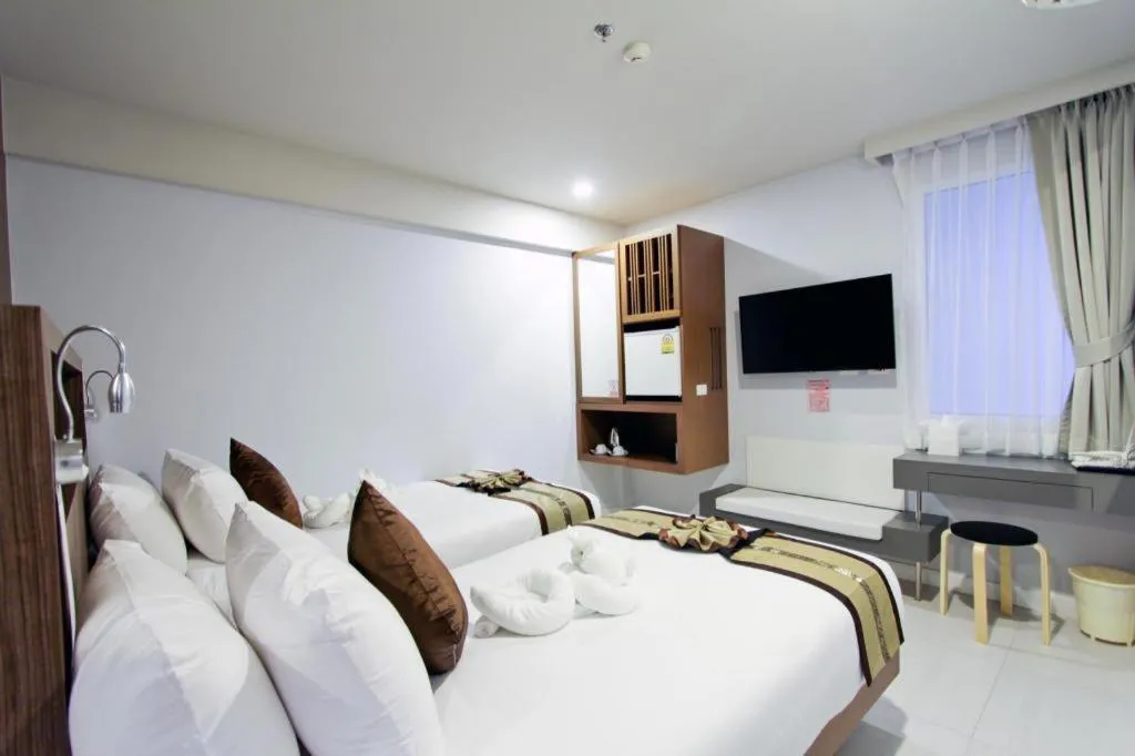 Bed in Elegancy Sansabai Hotel