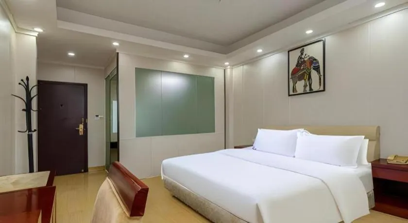 Bed in Jian Guo Grand Hotel