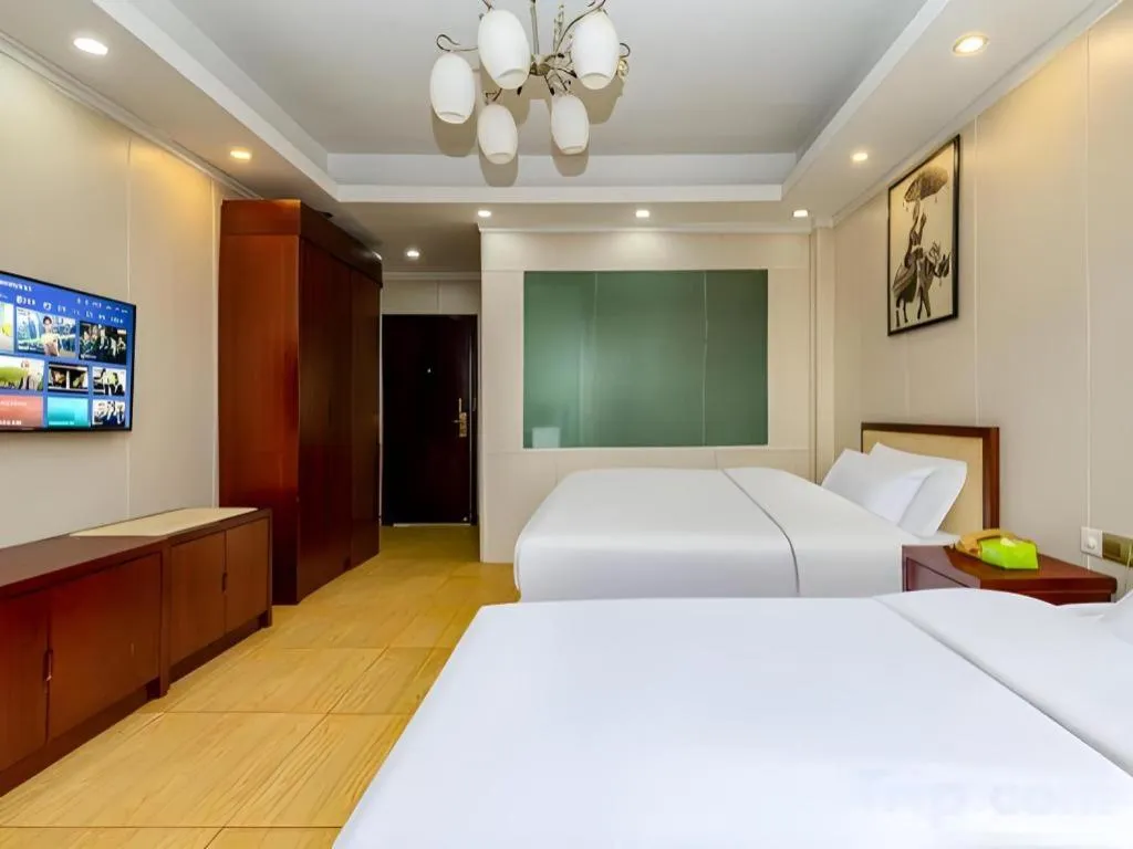 Bed in Jian Guo Grand Hotel