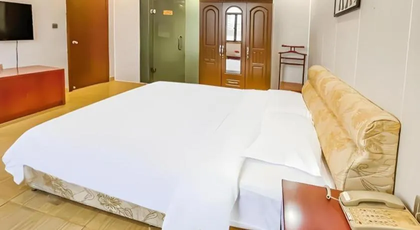 Bed in Jian Guo Grand Hotel