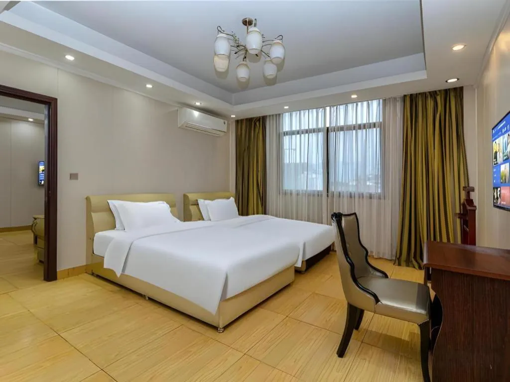 Bed in Jian Guo Grand Hotel