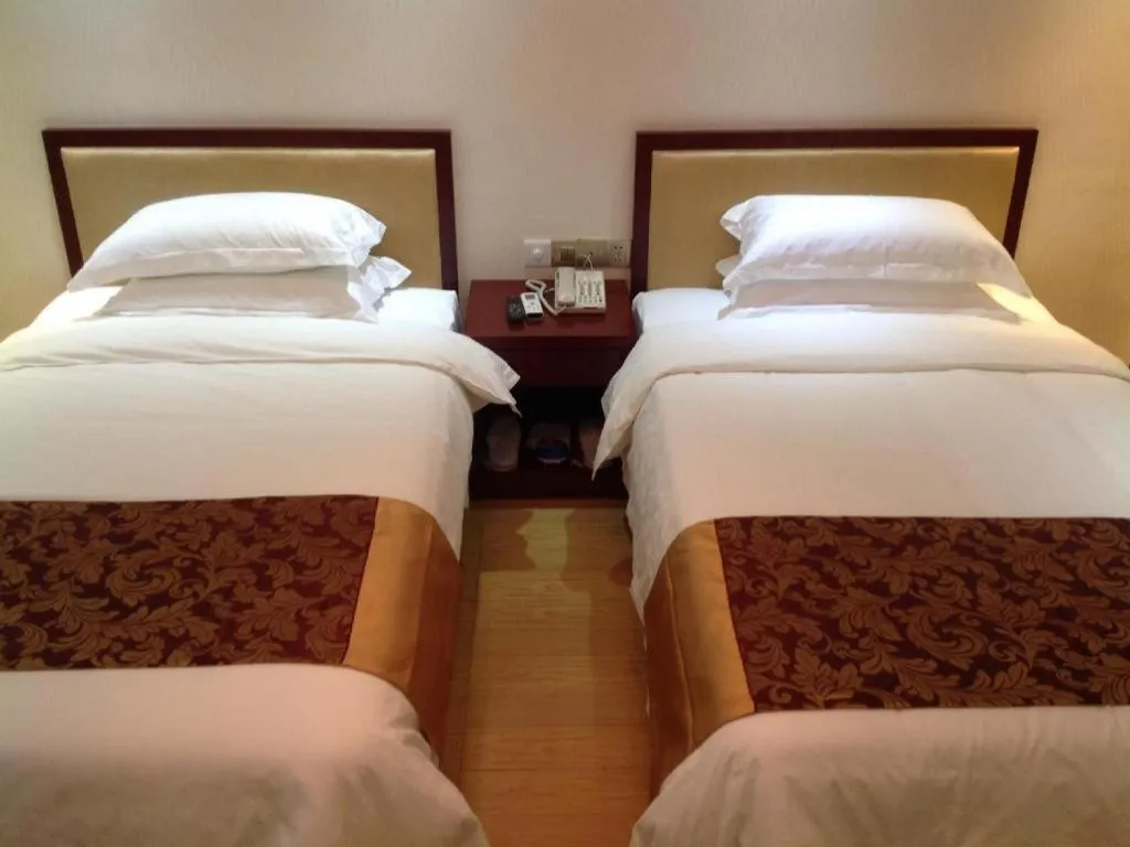 Bed in Jian Guo Grand Hotel