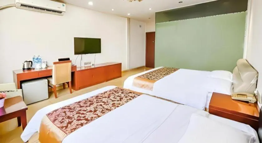 Bed in Jian Guo Grand Hotel