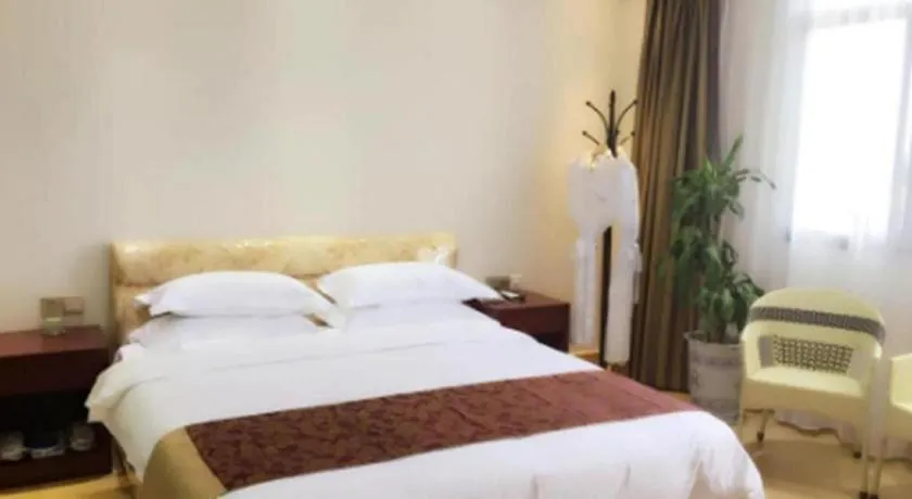 Bed in Jian Guo Grand Hotel