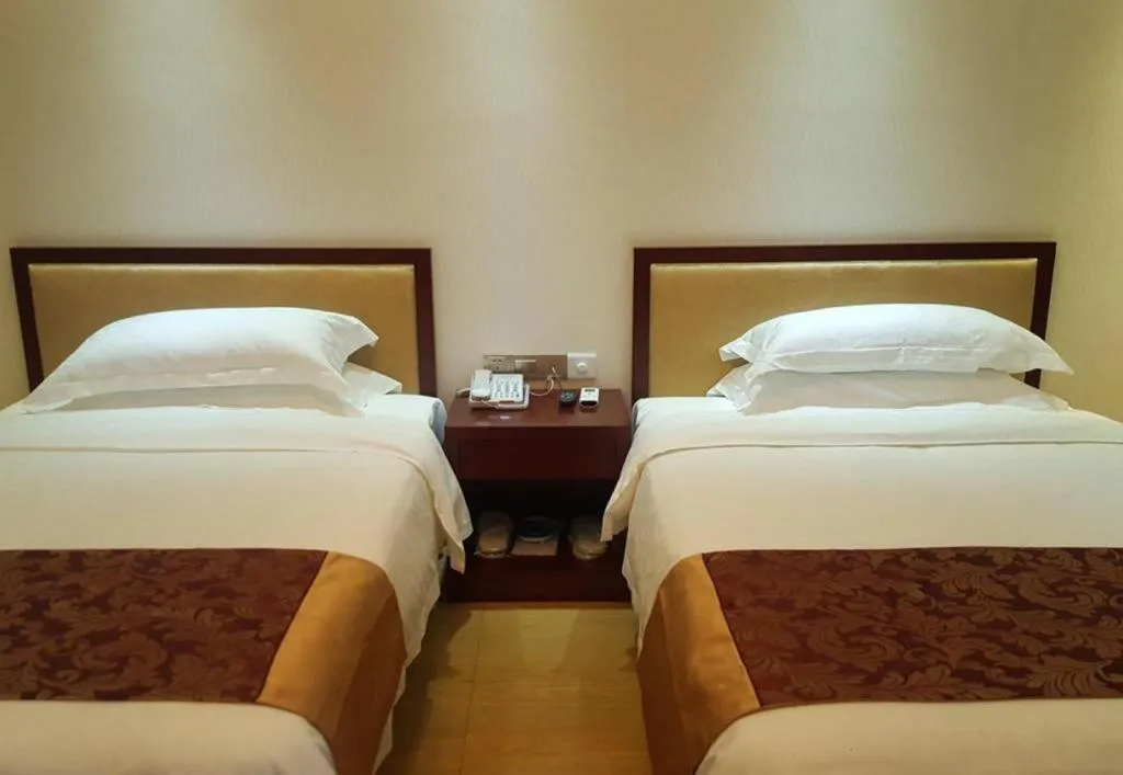 Bed in Jian Guo Grand Hotel