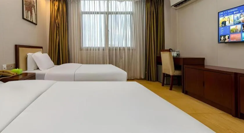 Bed in Jian Guo Grand Hotel