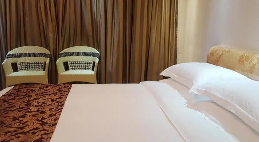 Bed in Jian Guo Grand Hotel