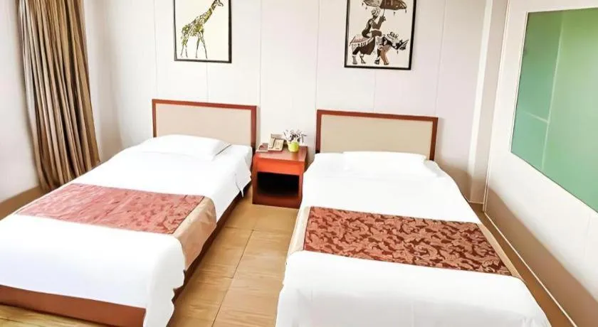 Bed in Jian Guo Grand Hotel