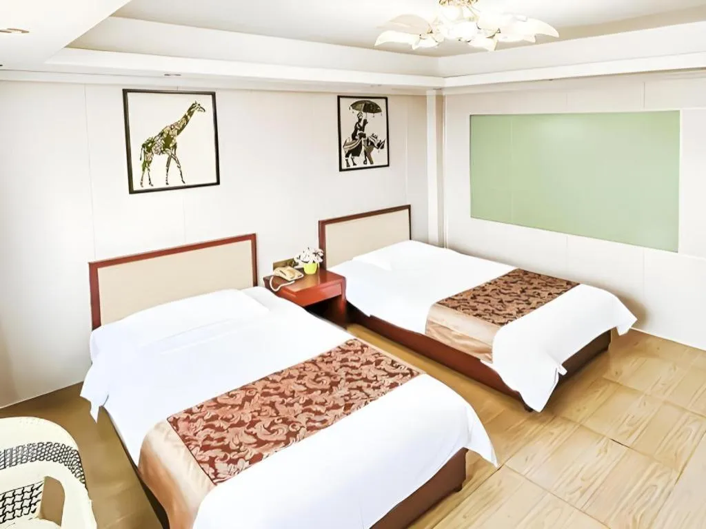 Bed in Jian Guo Grand Hotel