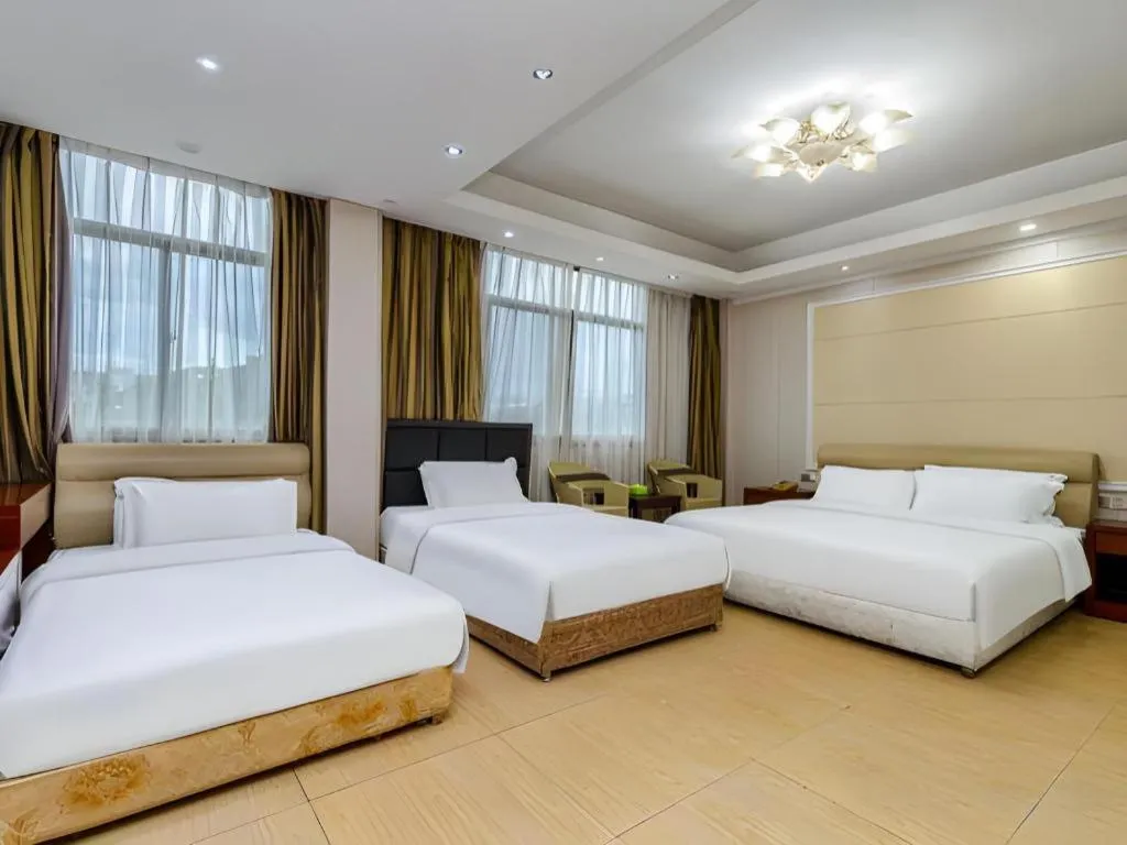 Bed in Jian Guo Grand Hotel