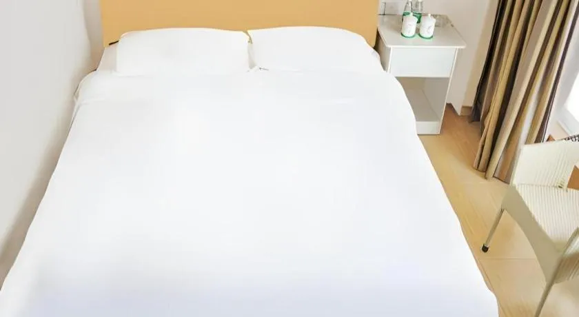 Bed in Jian Guo Grand Hotel