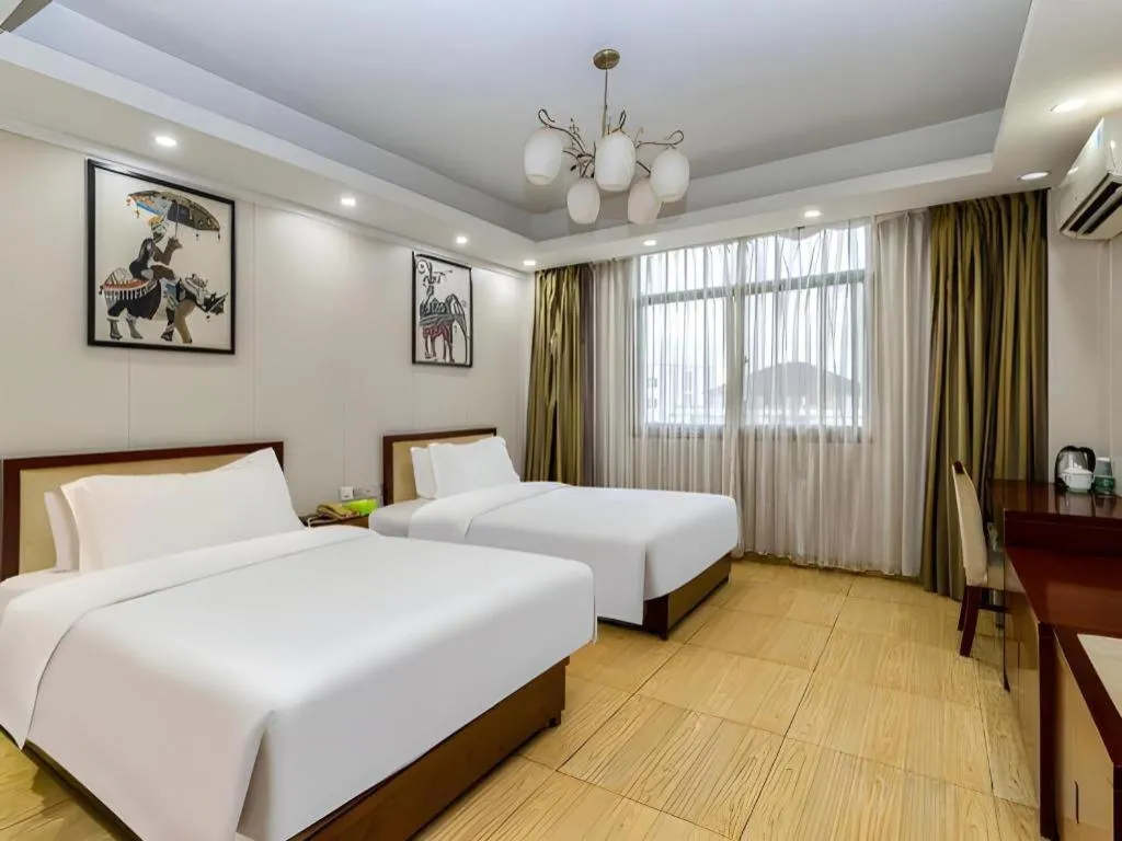 Bed in Jian Guo Grand Hotel