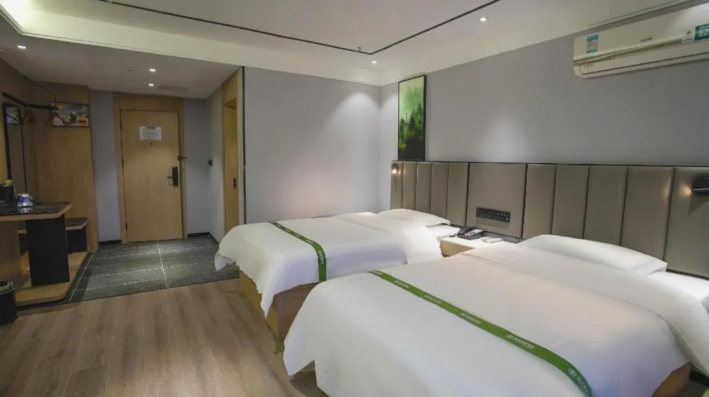 Bed in GreenTree Inn LiaoCheng LinQing HaiShan Building Express Hotel