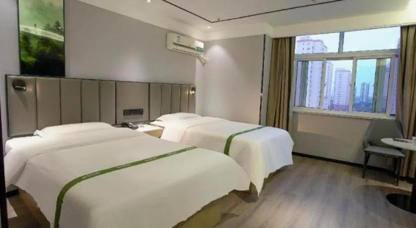 Bed in GreenTree Inn LiaoCheng LinQing HaiShan Building Express Hotel