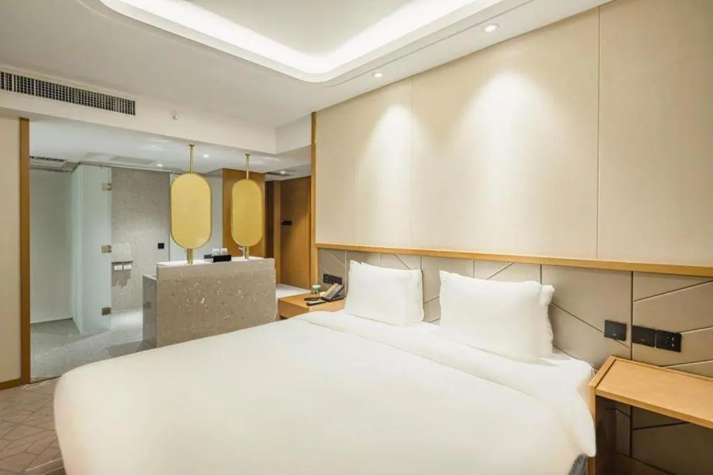 Bed in Gtel Rock City Qingdao Hotel