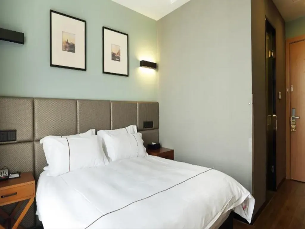 Bed in Muyra Hotel Shanghai