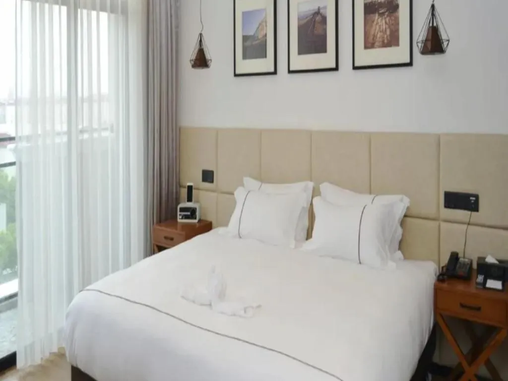 Bed in Muyra Hotel Shanghai