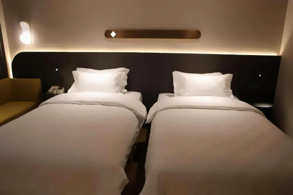 Bed in Jinjiang Inn Henan Museum Hutun Metro Station