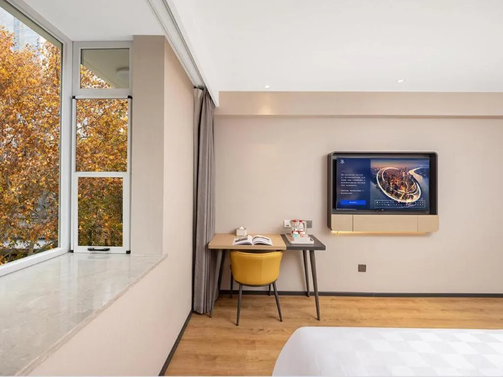 Bed in Jinjiang Inn Henan Museum Hutun Metro Station