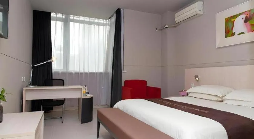 Bed in Jinjiang Inn Changzhou Global Dinosaur City Olympic Center