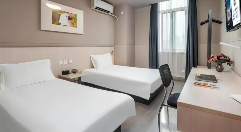 Bed in Jinjiang Inn Changzhou Global Dinosaur City Olympic Center