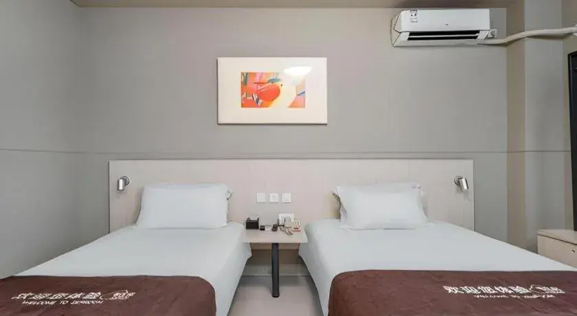 Bed in Jinjiang Inn Changzhou Global Dinosaur City Olympic Center Bed in Jinjiang Inn Changzhou Global Dinosaur City Olympic Center