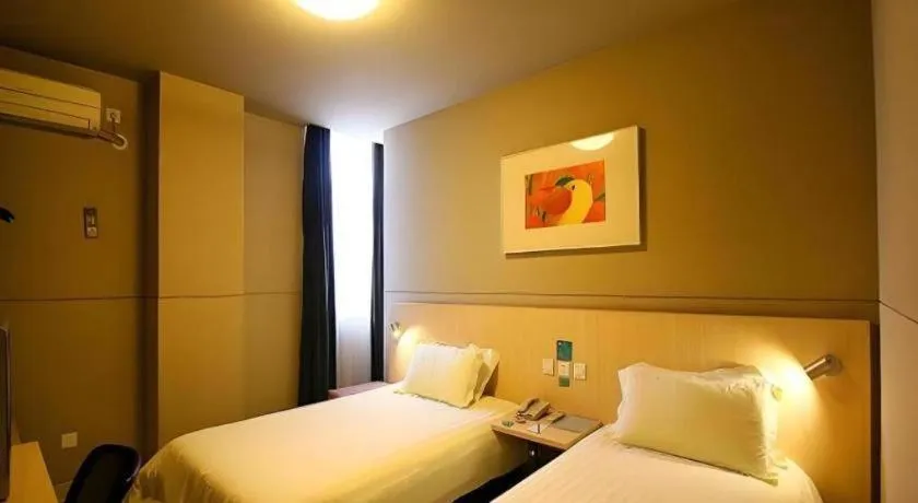 Bed in Jinjiang Inn Changzhou Global Dinosaur City Olympic Center