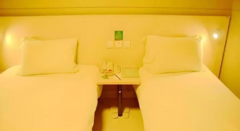 Bed in Jinjiang Inn Changzhou Global Dinosaur City Olympic Center