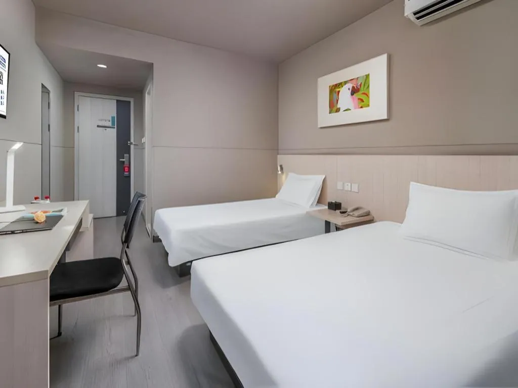 Bed in Jinjiang Inn Changzhou Global Dinosaur City Olympic Center