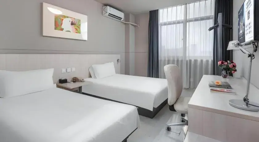Bed in Jinjiang Inn Changzhou Global Dinosaur City Olympic Center Bed in Jinjiang Inn Changzhou Global Dinosaur City Olympic Center