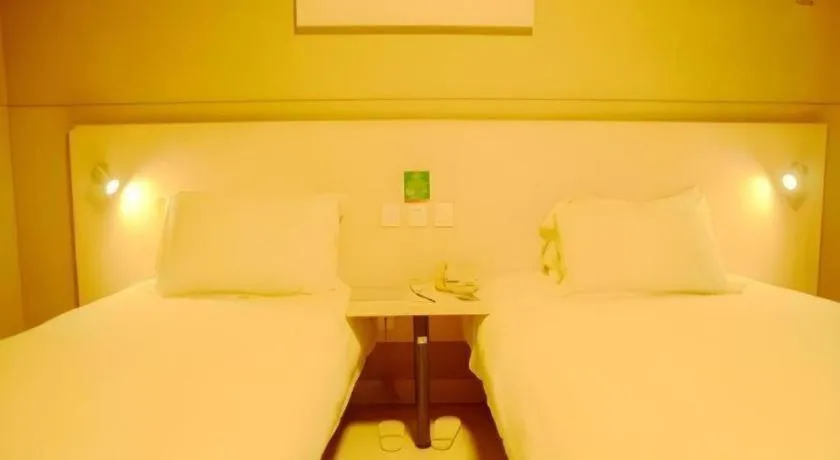 Bed in Jinjiang Inn Changzhou Global Dinosaur City Olympic Center
