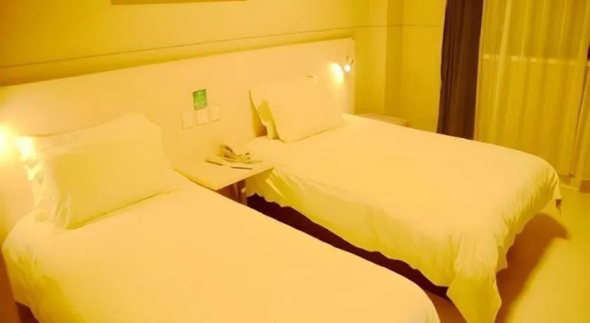 Bed in Jinjiang Inn Changzhou Global Dinosaur City Olympic Center