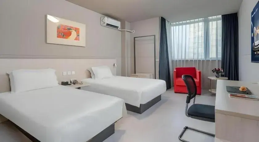 Bed in Jinjiang Inn Changzhou Global Dinosaur City Olympic Center Bed in Jinjiang Inn Changzhou Global Dinosaur City Olympic Center