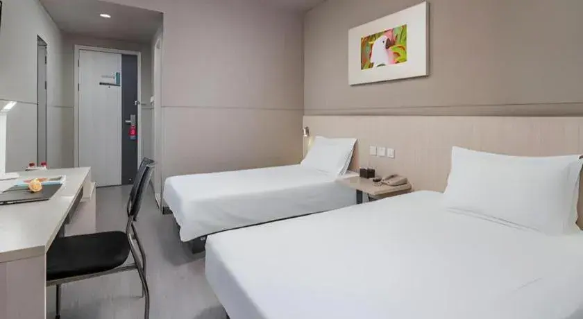 Bed in Jinjiang Inn Changzhou Global Dinosaur City Olympic Center Bed in Jinjiang Inn Changzhou Global Dinosaur City Olympic Center