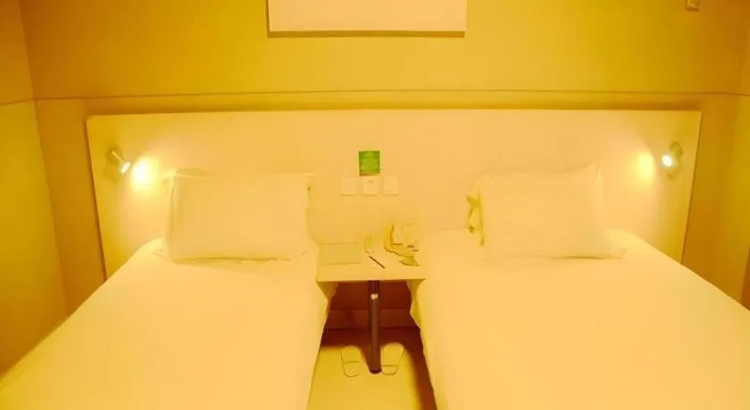 Bed in Jinjiang Inn Changzhou Global Dinosaur City Olympic Center