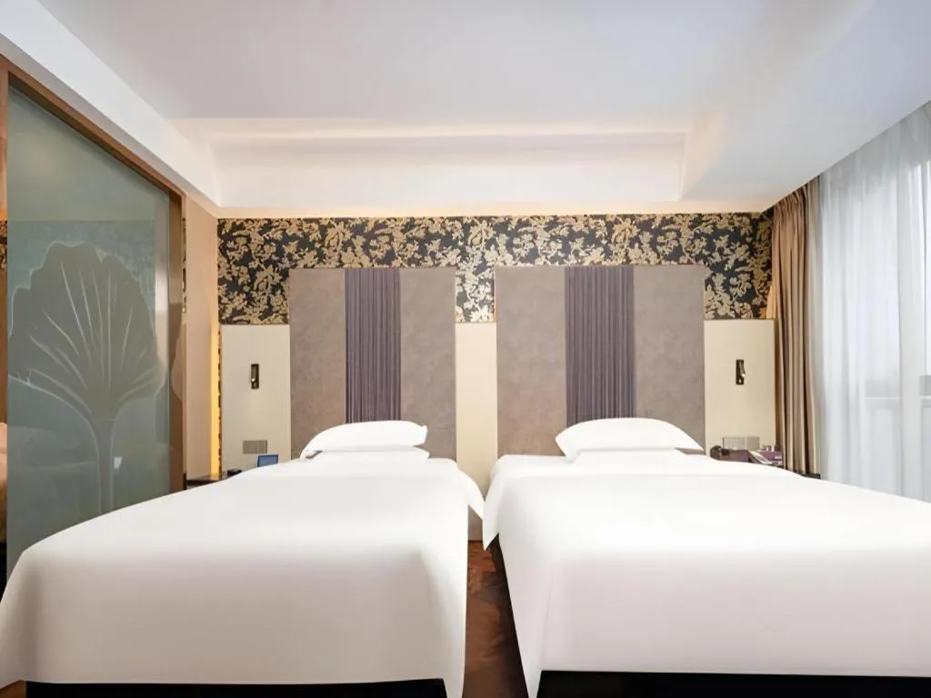 Bed in Jinjiang Metropolo Hotel - Taizhou Wanda Plaza