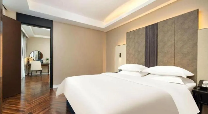 Bed in Jinjiang Metropolo Hotel - Taizhou Wanda Plaza