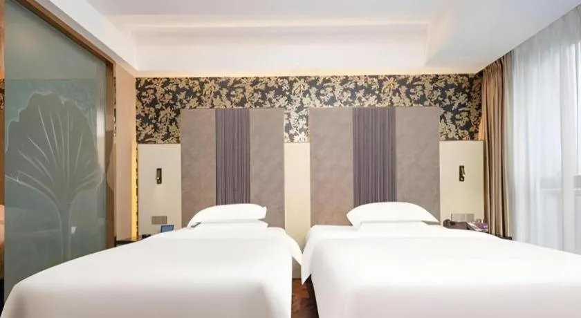 Bed in Jinjiang Metropolo Hotel - Taizhou Wanda Plaza